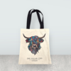 a white bag with a colorful face on it