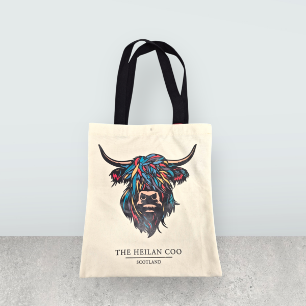 a white bag with a colorful face on it